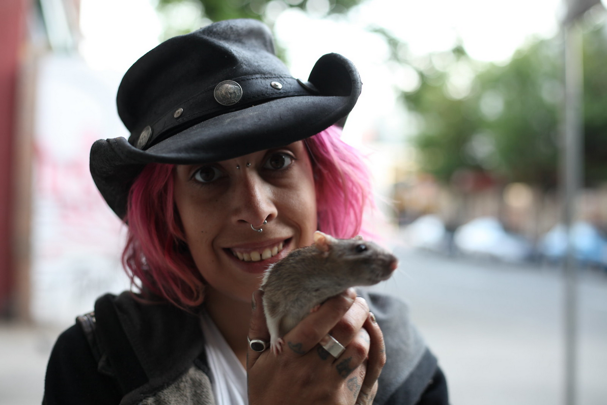 Young woman in opiate recovery with reward pet rat - DTES, Vancouver, BC